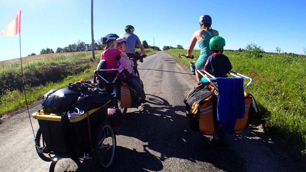 Tips to Planning a Family Vacation; Family of 5 on bike rides with small children