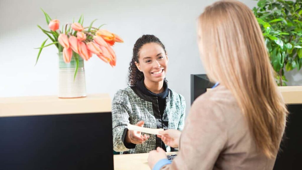 Investing In Savings Bonds; Bank Teller and Customer