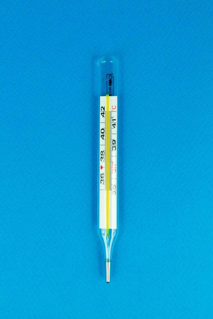 A Thermometer on a Blue Surface