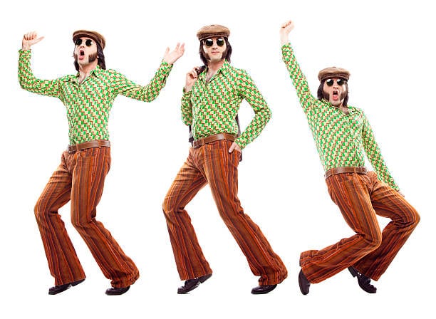 Three people in vintage clothing consisting of green patterned shirts, brown striped pants, and hats are posing in different dance moves against a white background.