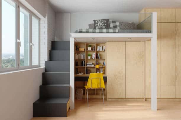 Loft-style room with a bed above a workspace, accessed by black stairs. Workspace includes a desk, shelves with books, and a yellow chair. Large window on the left.